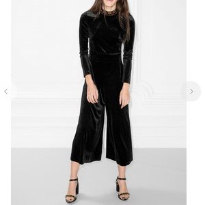 Perfect for the holidays! Black velvet jumpsuit with rhinestone embellishments